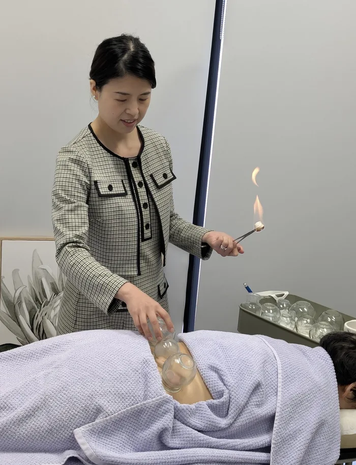 Fire cupping being applied during a treatment